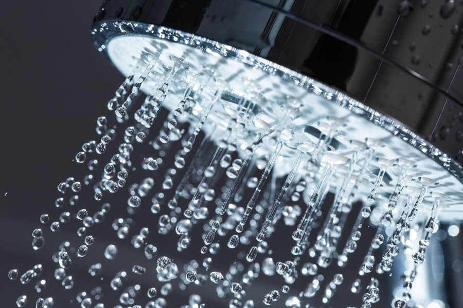 Shower head running hot water